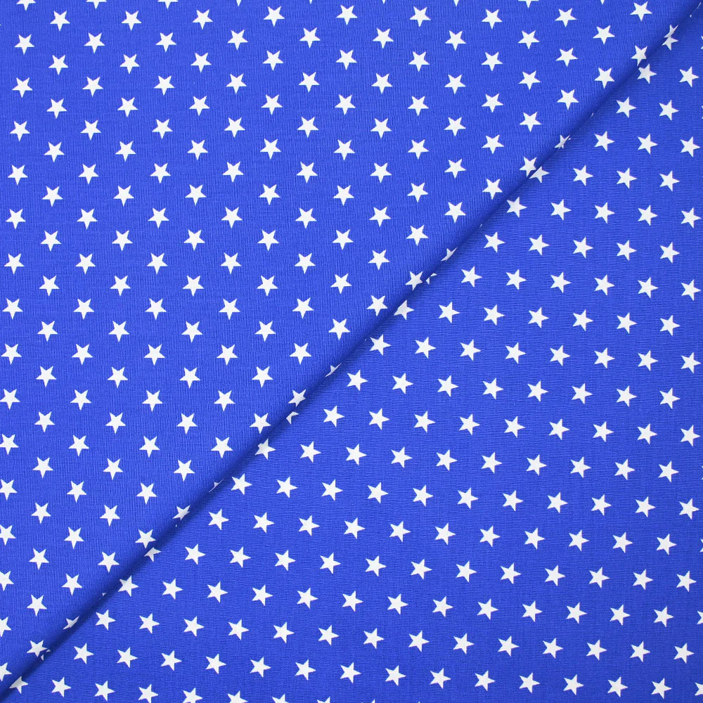 Coton imprimé étoiles fond bleu roi