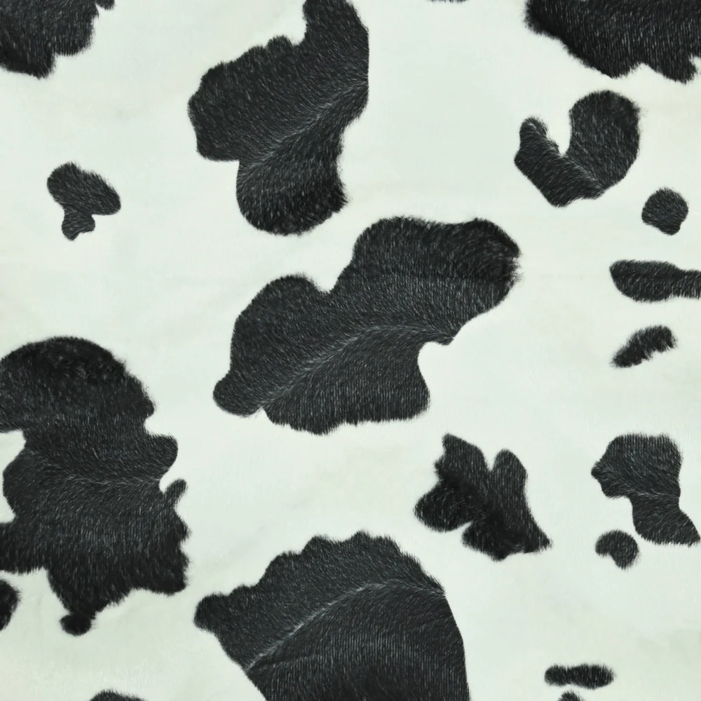 Fausse fourrure poils mi-longs vache noir