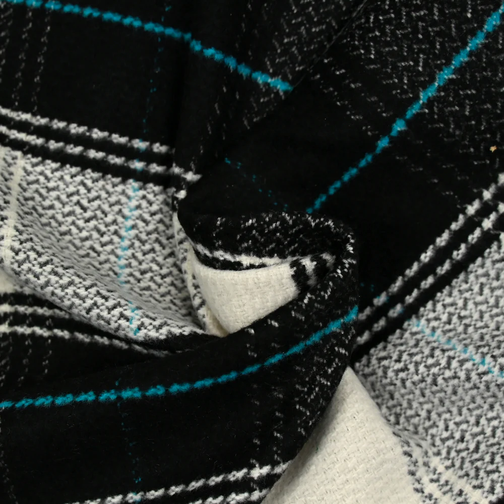 Lainage polyester à carreaux noir ligne turquoise - Image 2