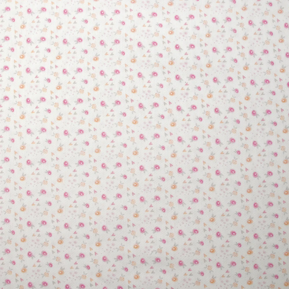 Piqué de coton imprimé fleurs et coeurs rose et orange fond blanc