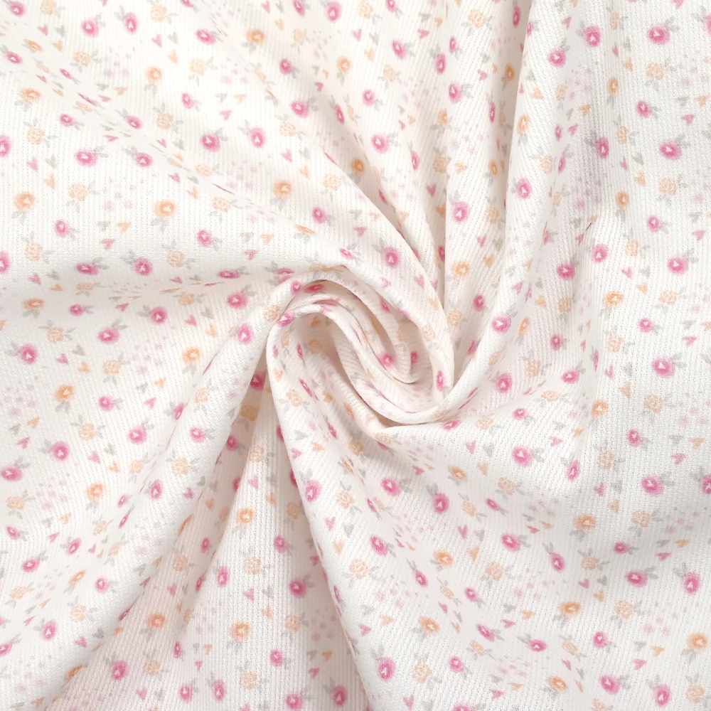 Piqué de coton imprimé fleurs et coeurs rose et orange fond blanc - Image 2