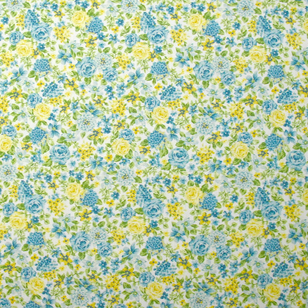 Piqué de coton imprimé les fleurs de Sarah bleu et jaune fond blanc