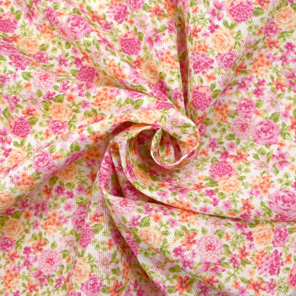 Piqué de coton imprimé les fleurs de Sarah rose et orange fond blanc - Image 2