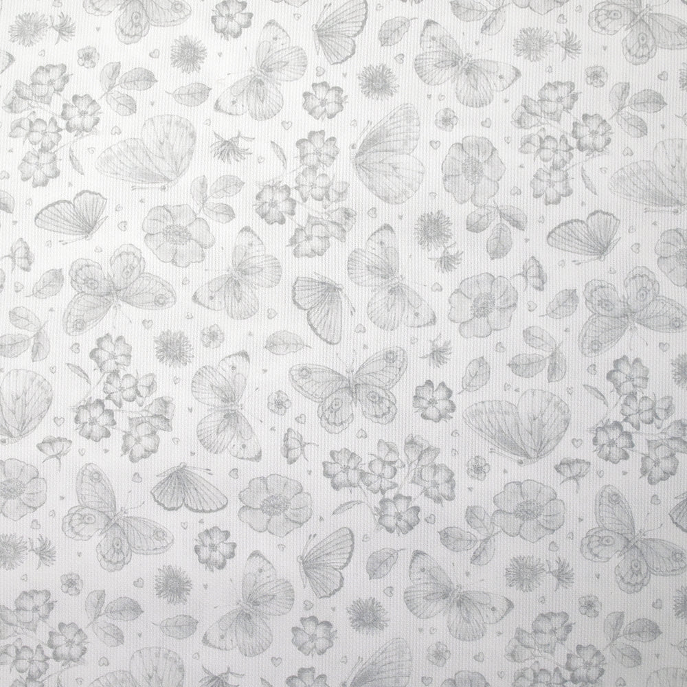 Piqué de coton imprimé papillons et fleurs fond blanc