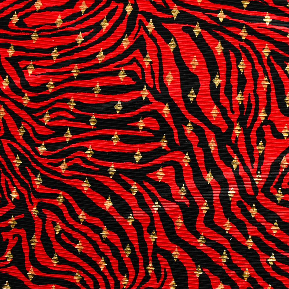 Plissé polyester imprimé écorce et losange doré fond rouge