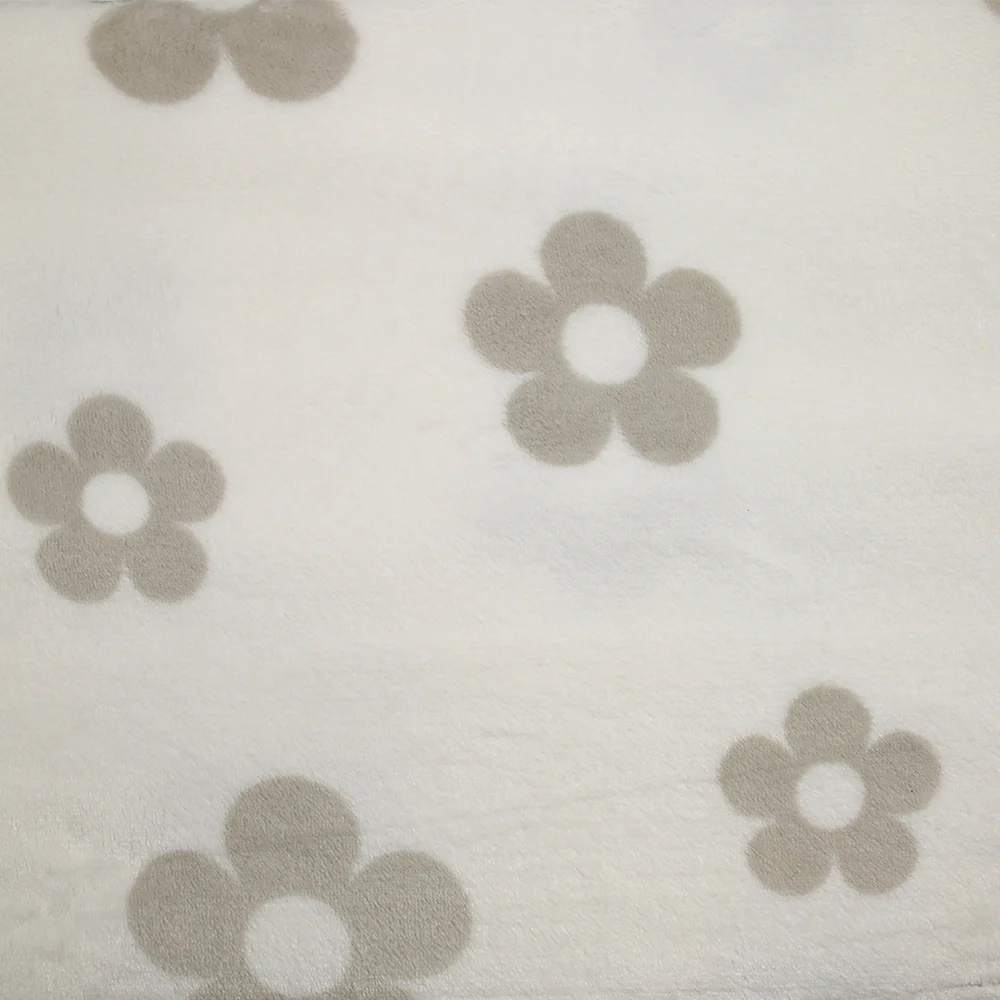 Polaire doudou imprimée fleurs grège fond blanc cassé