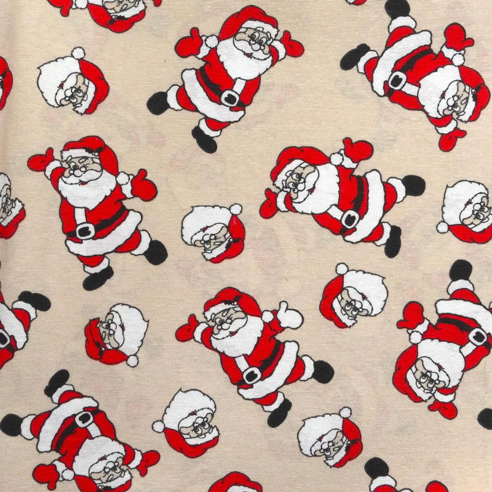 Polycoton imprimé Père Noël fond ficelle