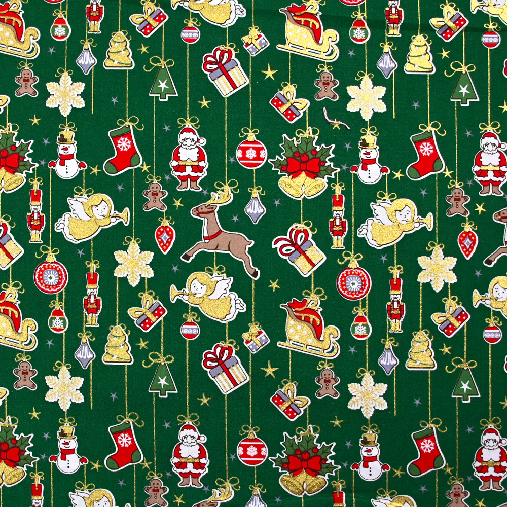Popeline de coton imprimée esprit de Noël doré fond vert
